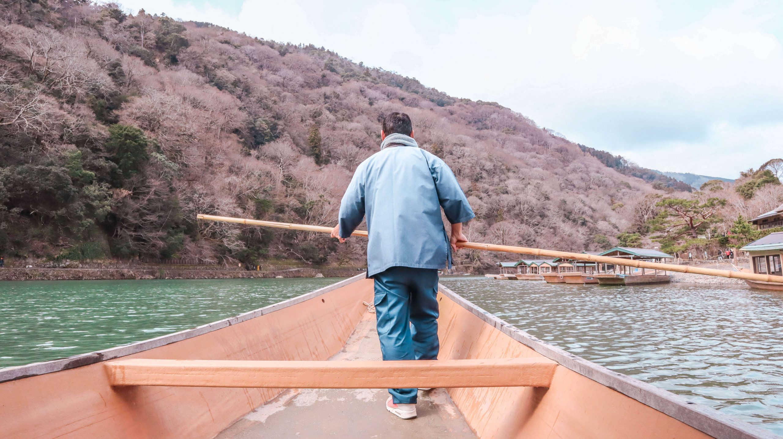 Kyoto one day itinerary: Arashiyama Tsusen boat at Togetsukyo Bridge